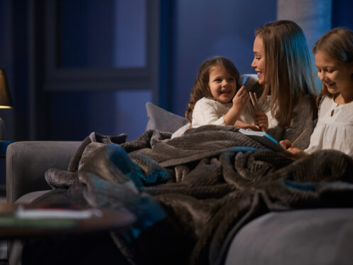 Family cuddled up on the couch in an Atlanta home.