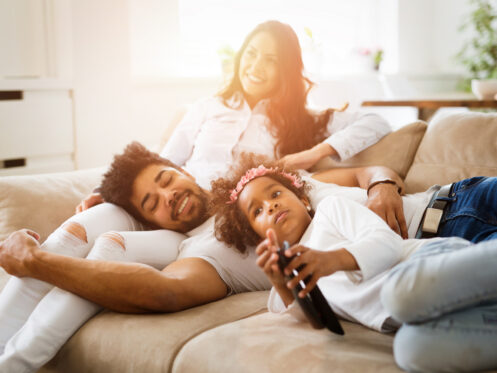 A young family watching a movie together in Atlanta