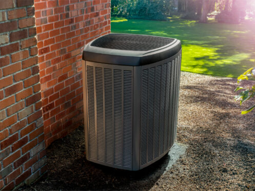 An air conditioner unit in the backyard of a Dallas, GA home