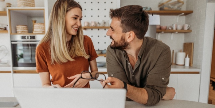 couple looking at their laptop